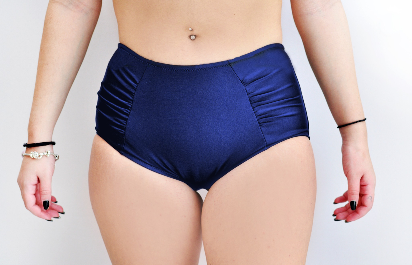 Sunlover Swimwear model wearing a pair of navy high-waisted swimsuit bottom