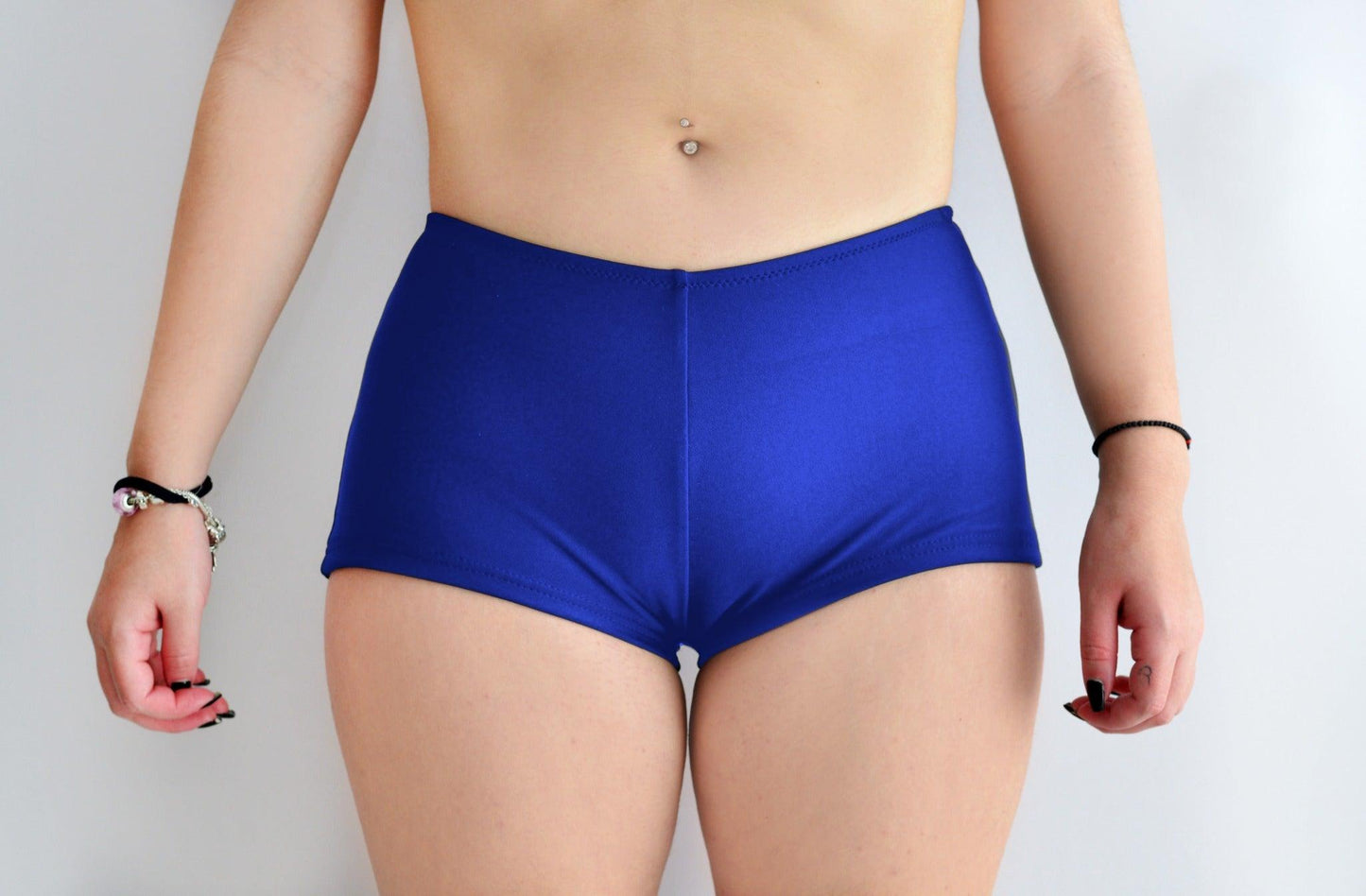 Sunlover Swimwear model wearing royal blue swim shorts on a plain background