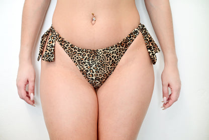 Tiger brasil bikini bottom front view with bow sides worn by a sunlover swimwear model (Colour: P22)