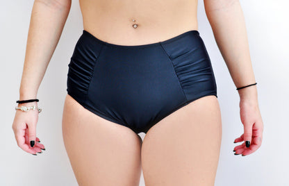 Sunlover Swimwear model wearing a pair of black high-waisted swimsuit bottom (Colour: BLK)