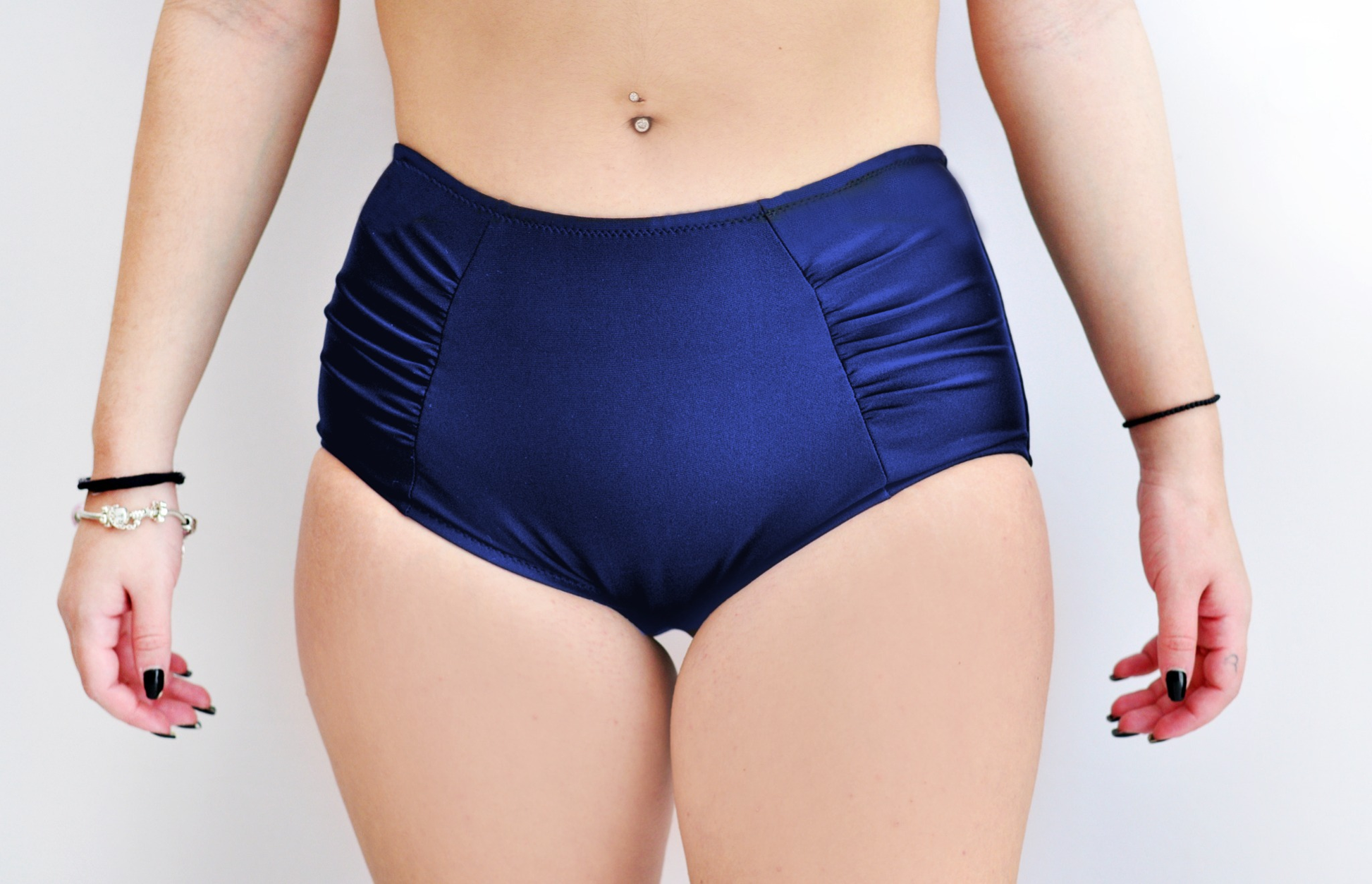 Sunlover Swimwear model wearing a pair of navy high-waisted swimsuit bottom (Colour: NVY)