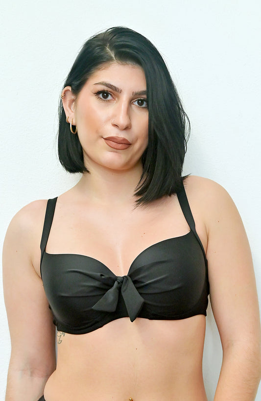 Sunlover Swimwear model wearing a black bikini top with a front bow detail on a plain background (Colour: BLK)