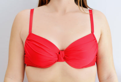 Red bikini twist top worn by a sunlover swimwear model (Colour: RED)