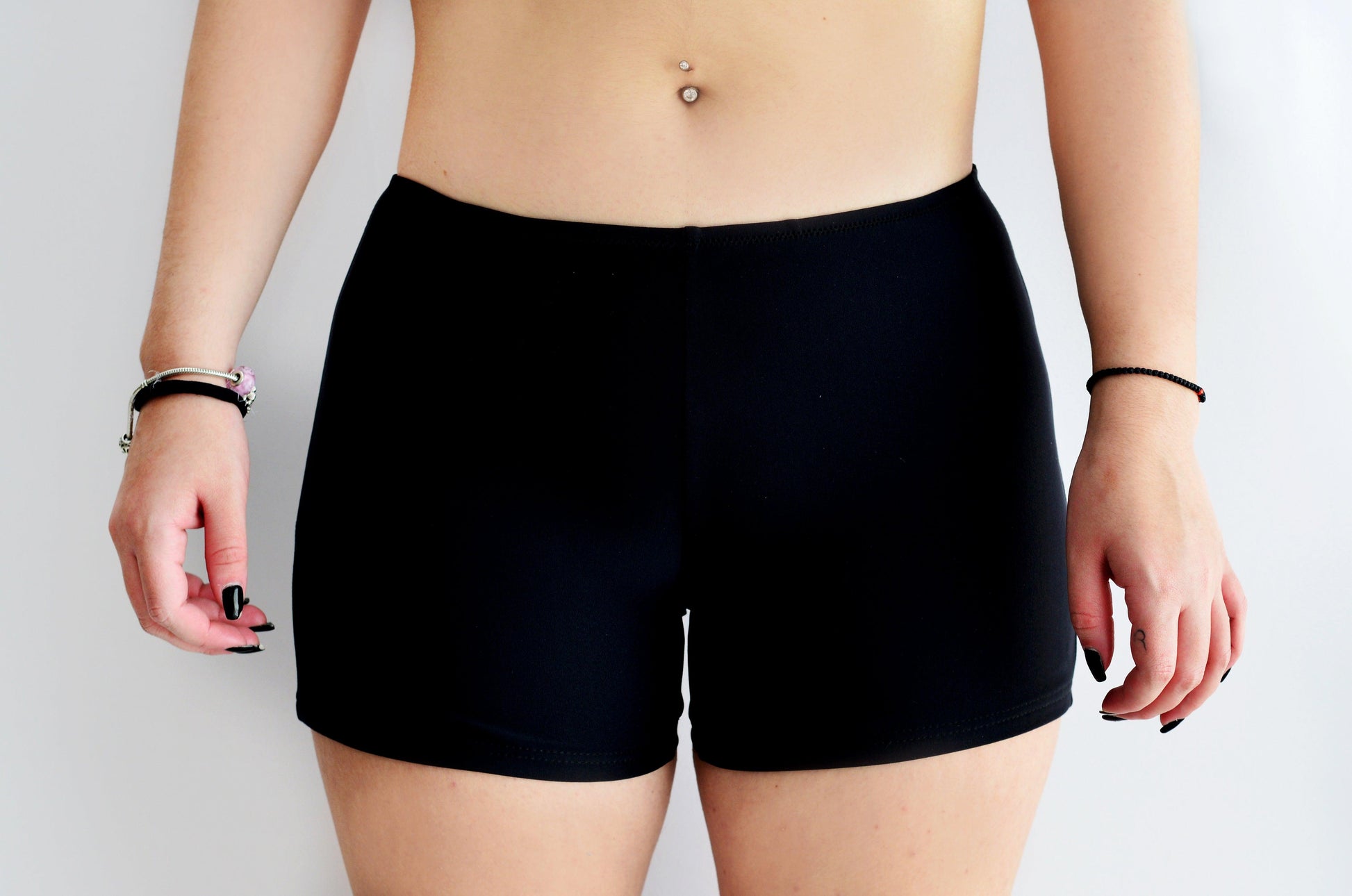 Sunlover swimwear model wearing black shorts on a plain background (Colour: BLK)