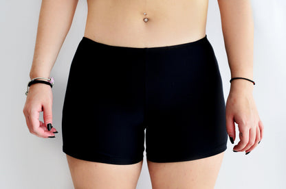 Sunlover swimwear model wearing black shorts on a plain background (Colour: BLK)