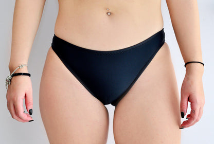 Sunlover Swimwear model wearing a classic black bikini bottom without side-ties (Colour: BLK)