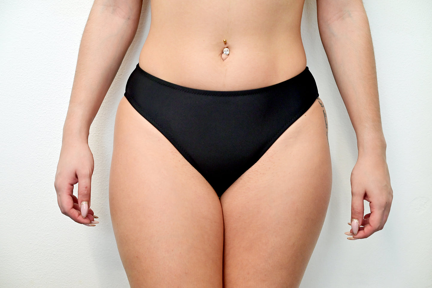 Sunlover Swimwear model wearing a black medium coverage bikini bottom (Colour: BLK)