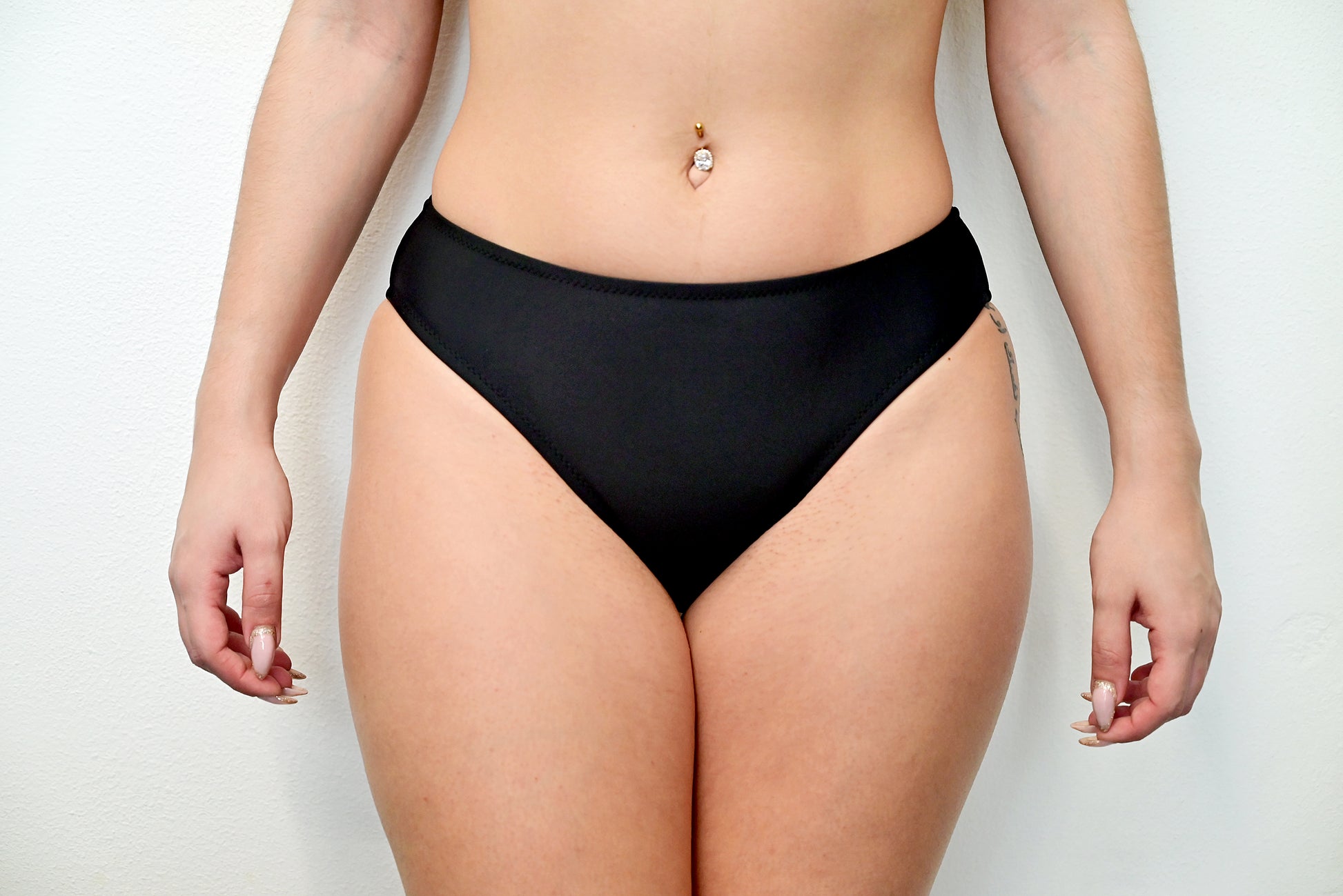 Sunlover Swimwear model wearing a black medium coverage bikini bottom (Colour: BLK)