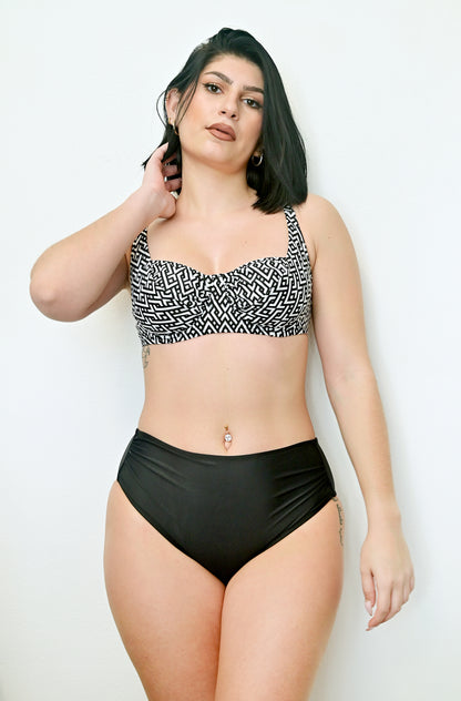 Sunlover swimwear model wearing a black and white patterned bikini top and black high-waisted bottoms on a white background (Colour: P25)