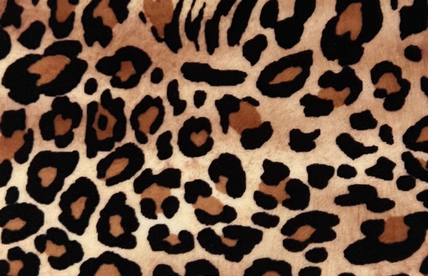 Leopard print pattern on a textured fabric background (Colour: P22)