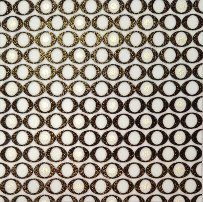 Close-up of fabric pattern of interlocking rings on a textured surface (Colour: P26)
